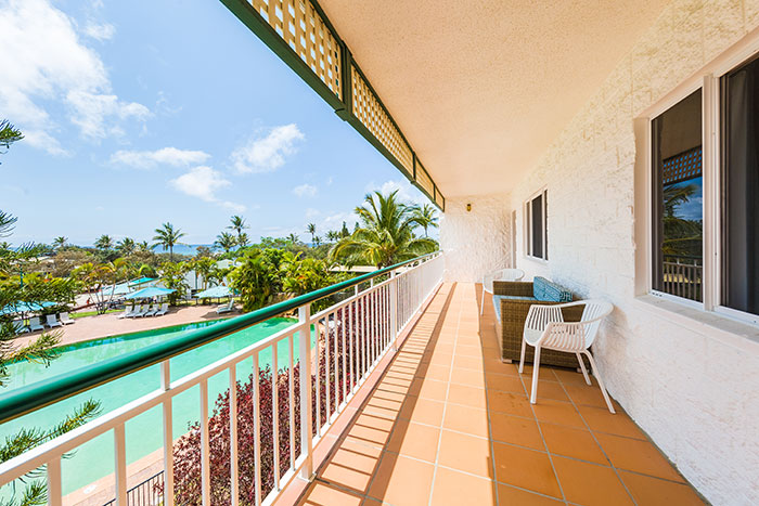 Balcony overlooking the pool and ocean at Eurong Beach Resort on K'gari