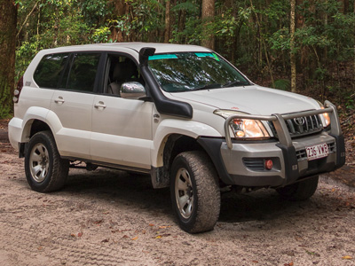 White Toyota LandCruiser wagon with snorkel, prepared for K'gari